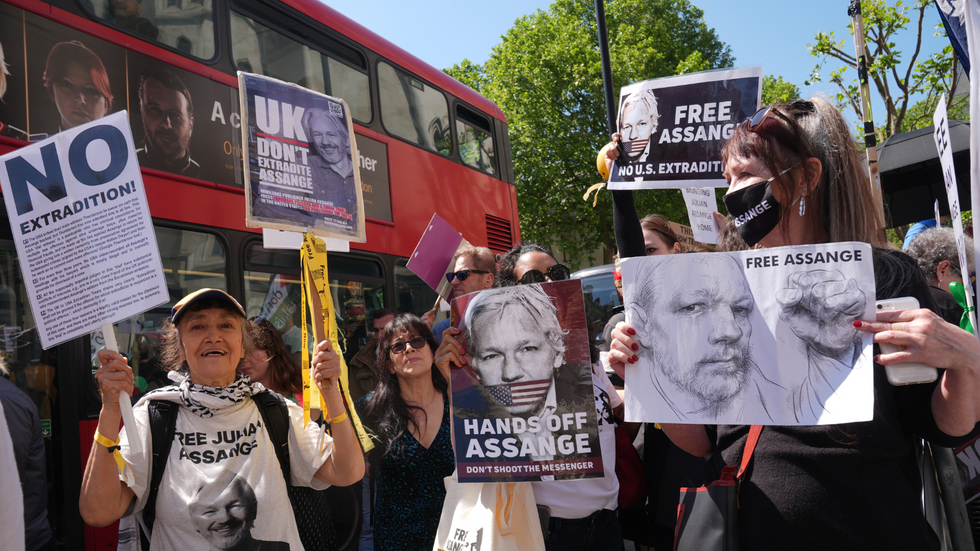 Supporters of Julian Assange outside the Royal Courts of Justice in London, ahead of the latest stage of his US extradition legal battle