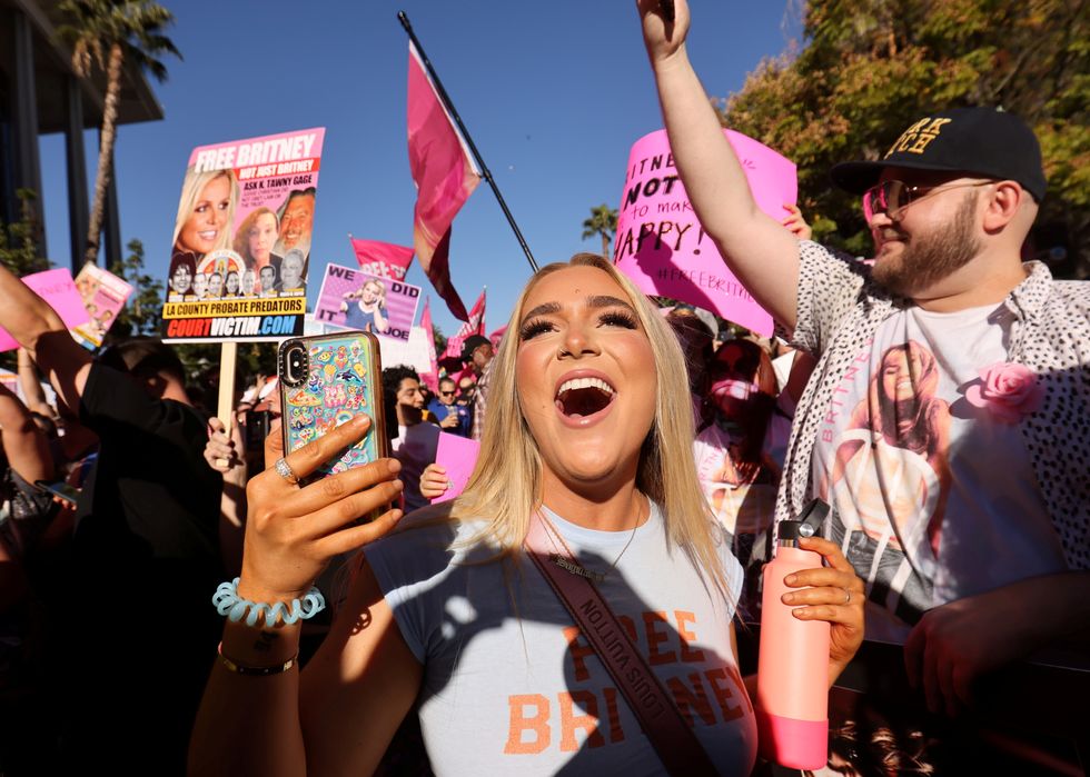 Supporters of singer Britney Spears celebrate as Spears' conservatorship is terminated, outside the Stanley Mosk Courthouse on the day of her conservatorship case hearing, in Los Angeles, California, U.S.