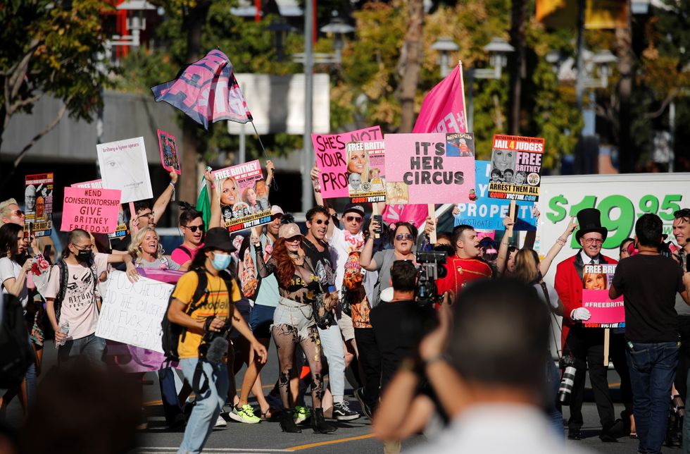 Supporters of singer Britney Spears celebrate the termination of her conservatorship, outside the Stanley Mosk Courthouse in Los Angeles, California, U.S.