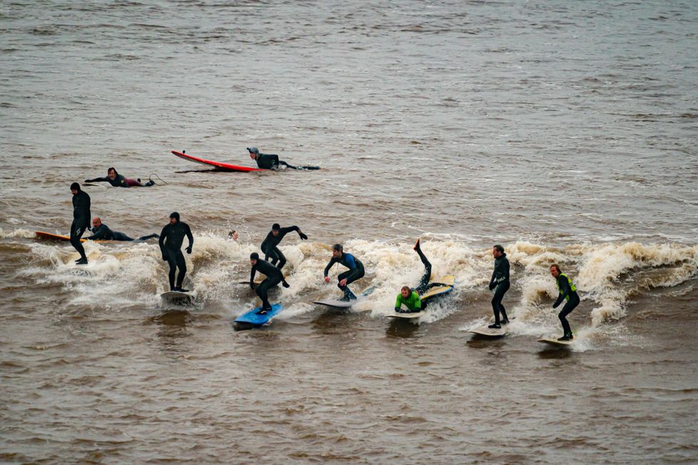 Surfers at Severn Bore