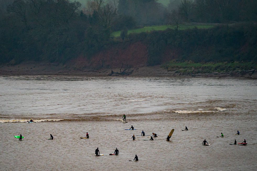 Surfers at Severn Bore