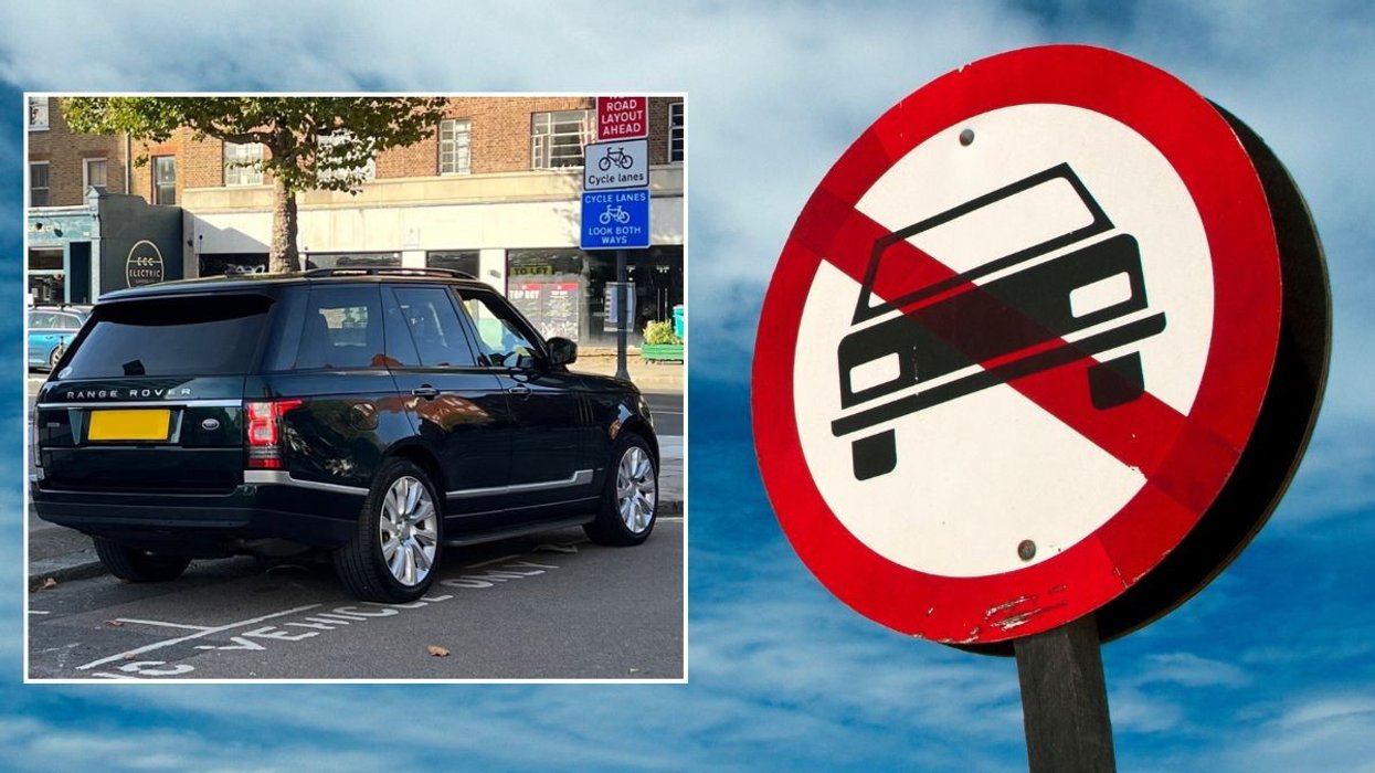 SUV parked and a car ban sign