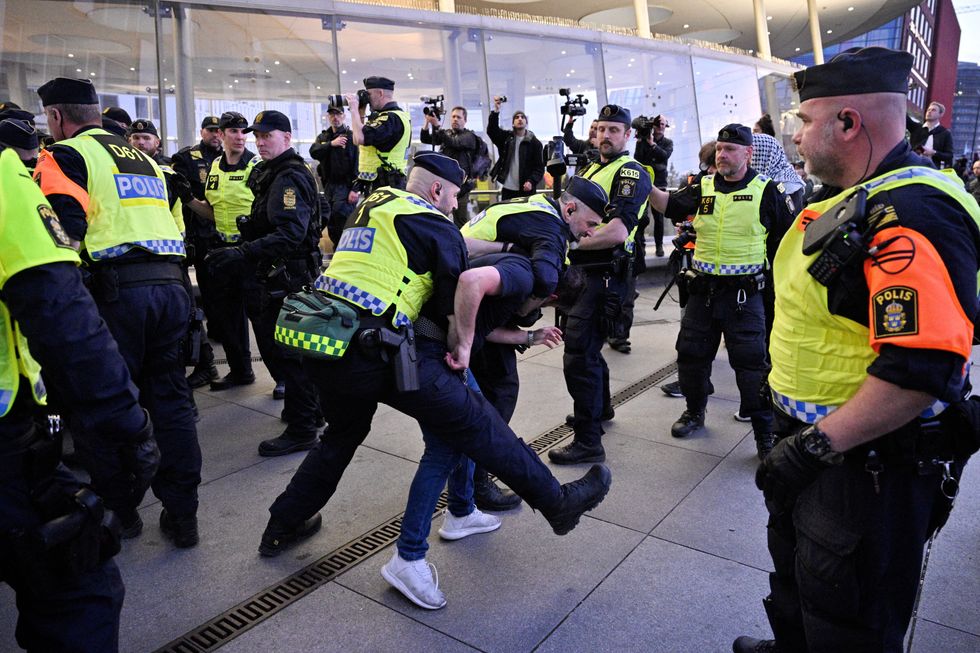 Swedish police handling protesters