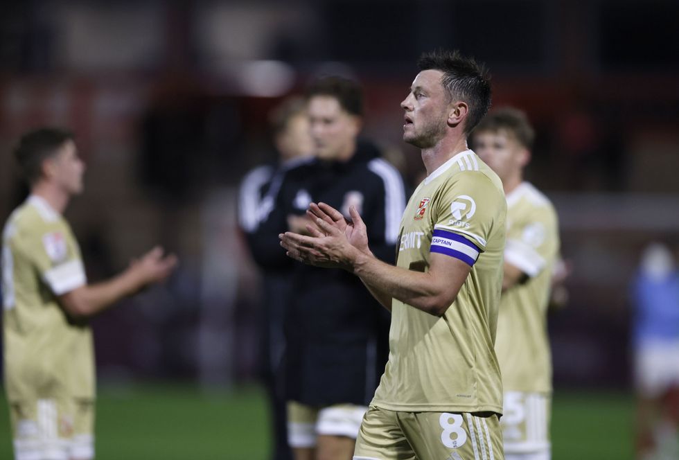 Swindon captain Ollie Clarke has been handed a seven-match ban