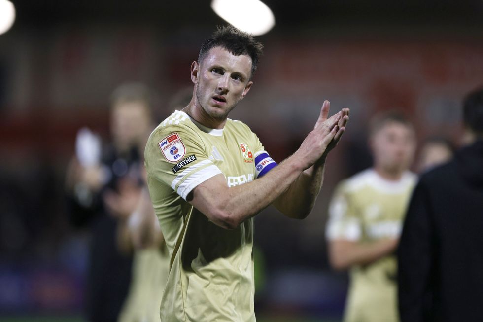 Swindon captain Ollie Clarke was initially banned following incidents involving contact with opponents' "private body parts"