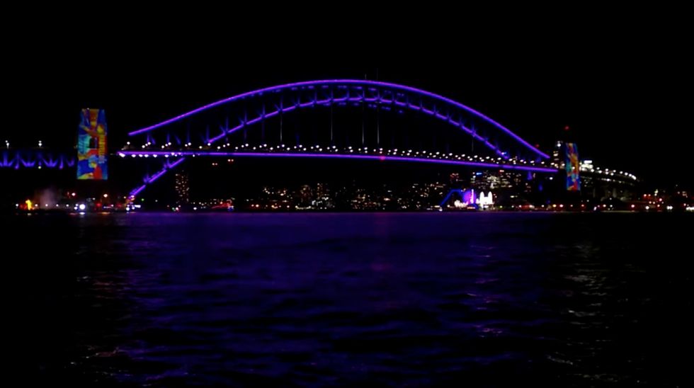 Sydney Harbour Bridge illuminated in %22royal purple%22
