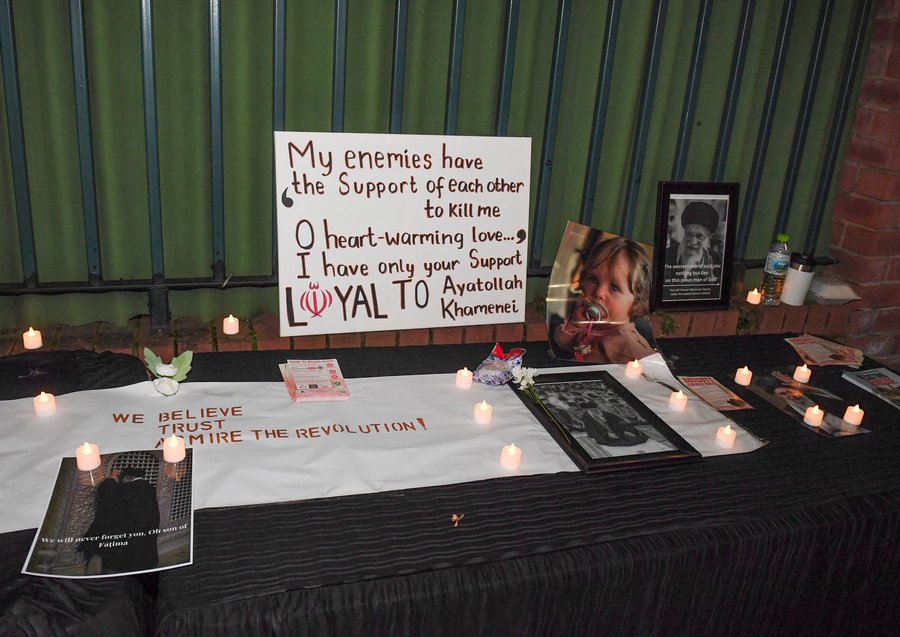 table at the Manchester vigil, quotes from the Ayatollah