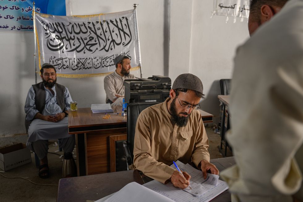 Taliban officials in Afghanistan process recent arrivals from Iran