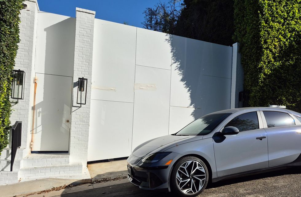 Tape covers areas where there are alleged bullet holes outside Rihanna's home