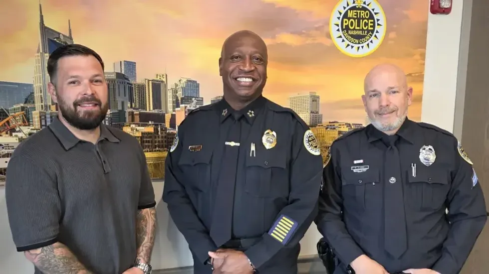 Taylor Johanson (left) with Chief John Drake (centre) and the officer he helped, Peter Kinsey (right), after the incident\u200b