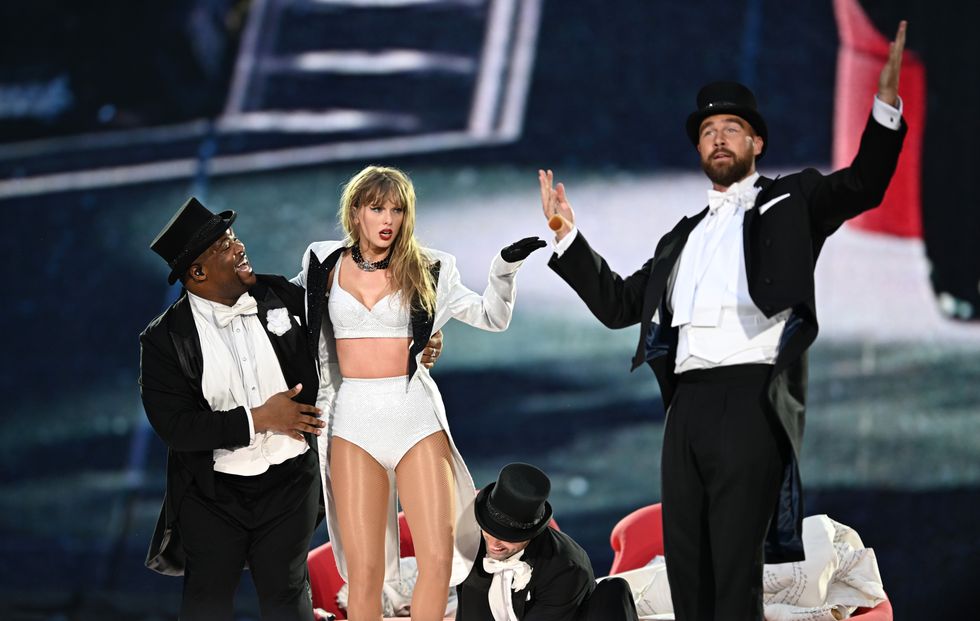 Taylor Swift with Travis Kelce on stage at Wembley Stadium