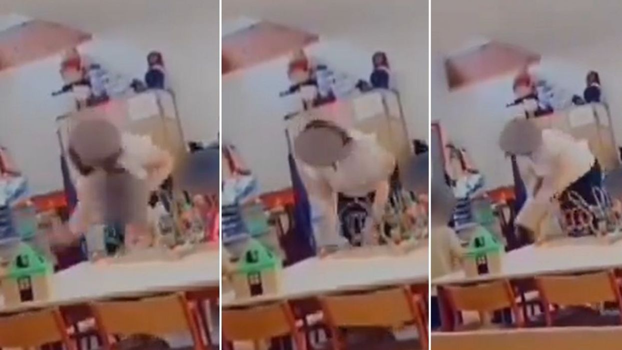 Teacher placed in police custody after being secretly filmed hitting three-year-old and 'spraying liquid in girl's face'