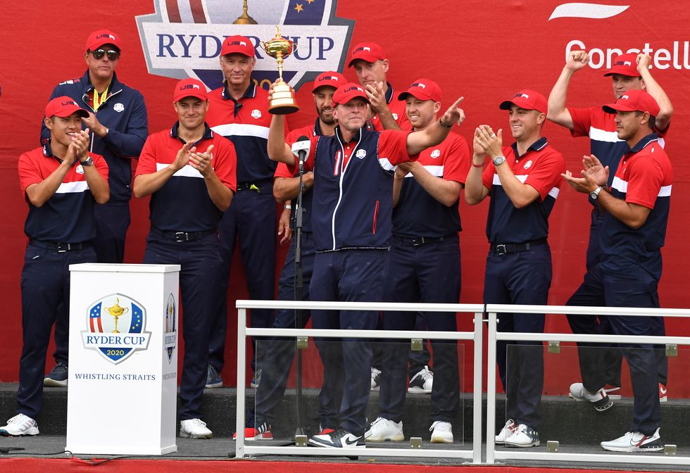 Team USA captain Steve Stricker celebrates with the team with the Ryder Cup trophy after victory against Team Europe