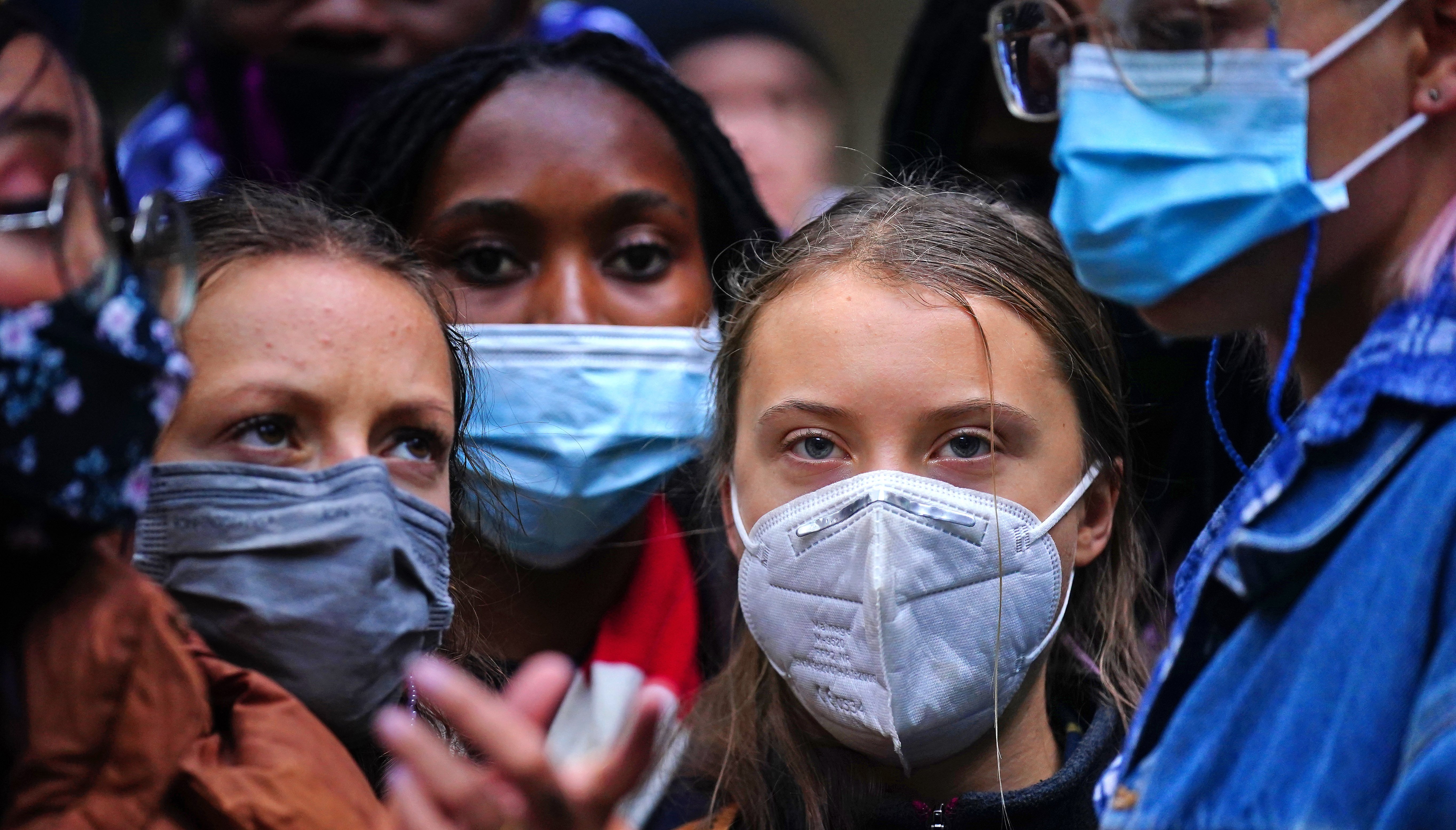 Teenage activist Greta Thunberg (centre right) joins activists taking part in the Youth Strike to Defund Climate Chaos protest against the funding of fossil fuels outside Standard Chartered Bank in London.
