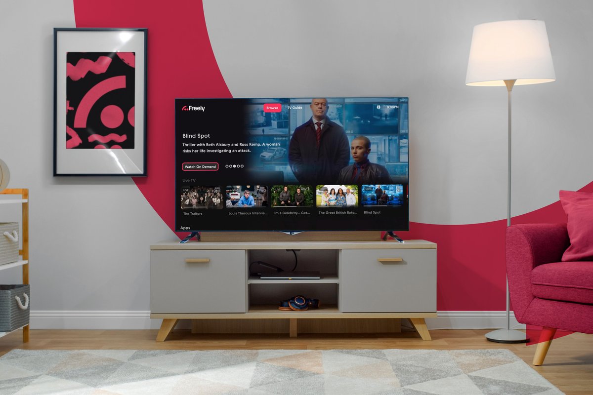 television on a small cabinet with the Wi-Fi symbol on the wall before