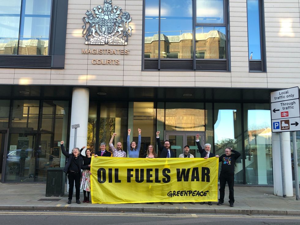 Ten Greenpeace activists outside Chelmsford Magistrates' Court, whose protest at an oil terminal forced a tanker carrying Russian diesel to U-turn in the River Thames have been cleared of aggravated trespass, with a judge stating Russia's war in Ukraine \%22could be described as terrorism\%22. Issue date: Friday November 4, 2022.