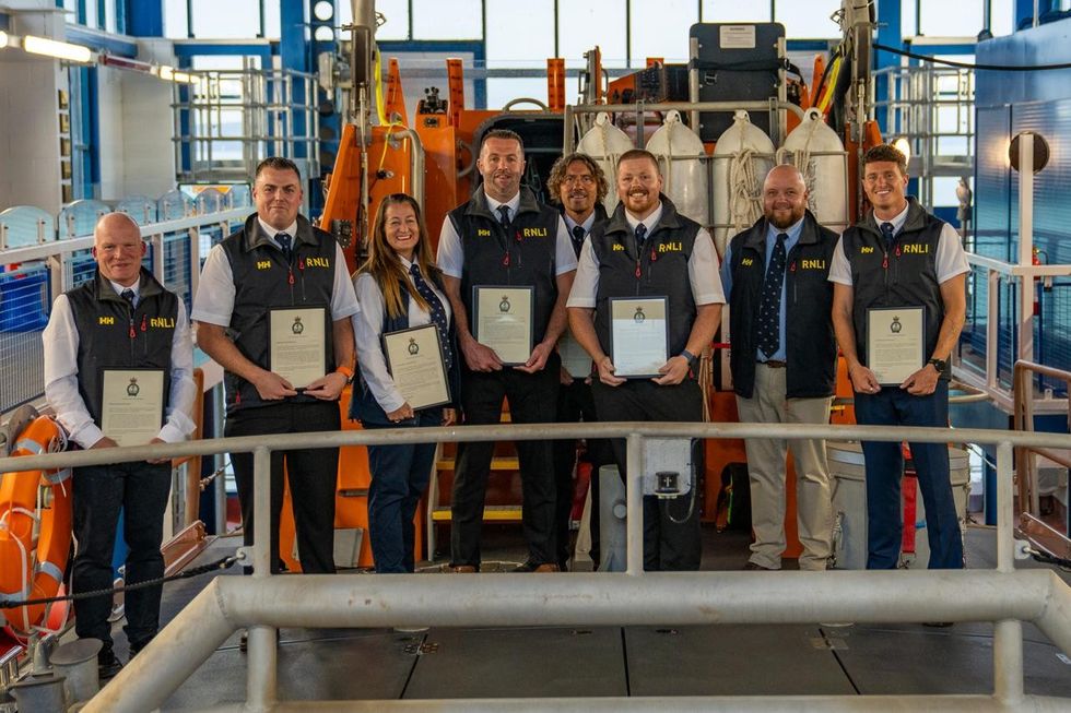 Tenby RNLI lifeboat crew members were recognised for saving lives in two daring sea rescues\u200b