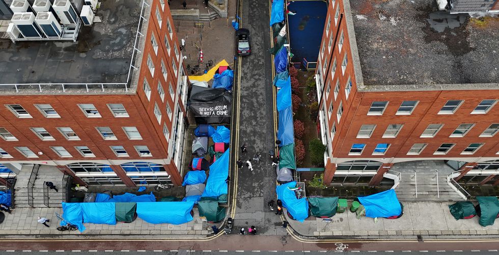 Tents housing asylum seekers near to the Office of International Protection,