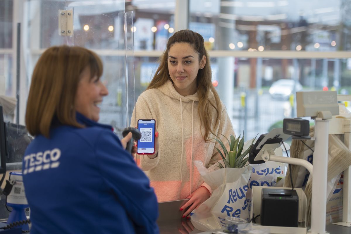 Tesco Clubcard being used on phone at till
