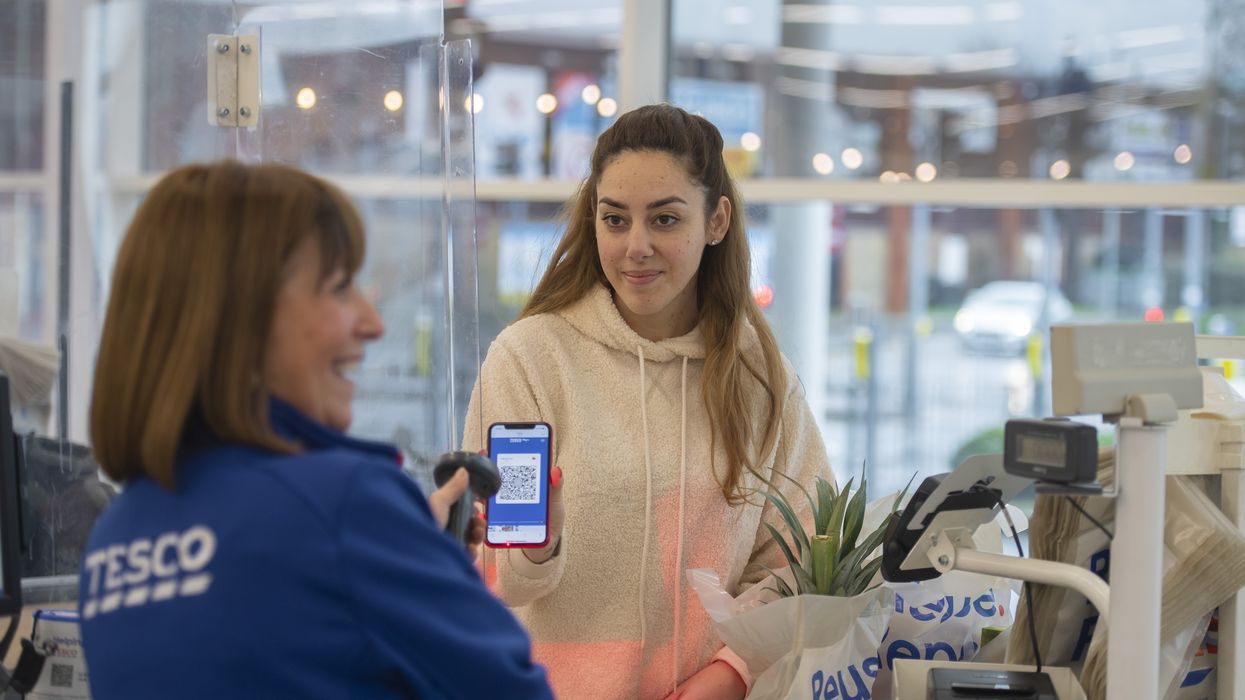 Tesco Clubcard being used on phone at till