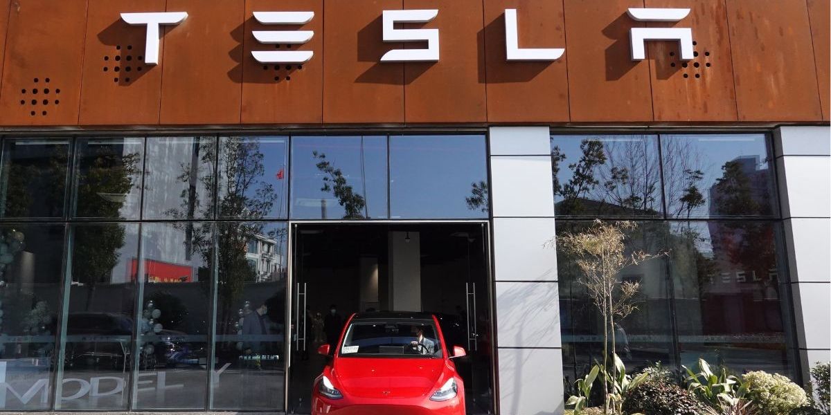 NextImg:Tesla investigated as door handles 'trap children inside cars' with drivers forced to smash windows