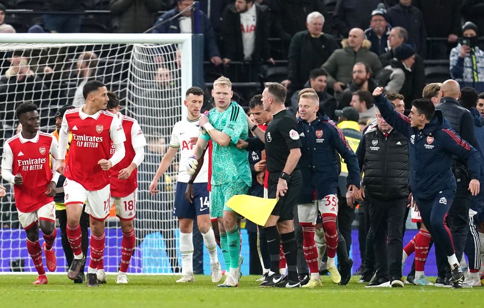 The Arsenal goalkeeper was kicked in the back.