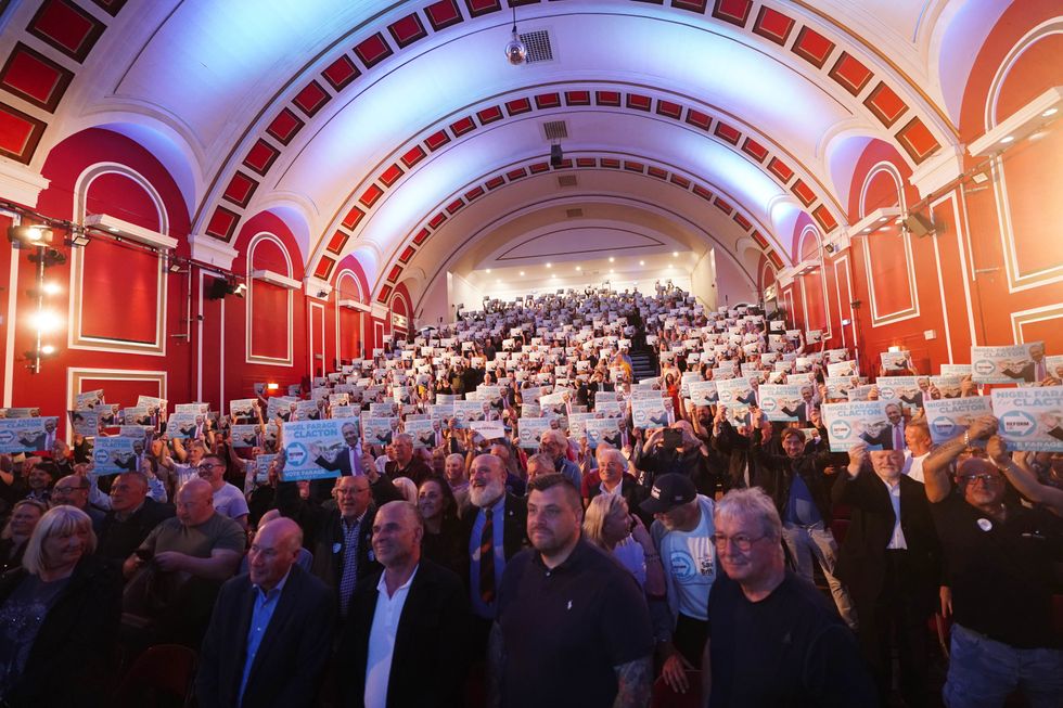 The audience listen to Reform UK leader Nigel Farage speaking at Princes Theatre in Clacton, while on the General Election campaign trail