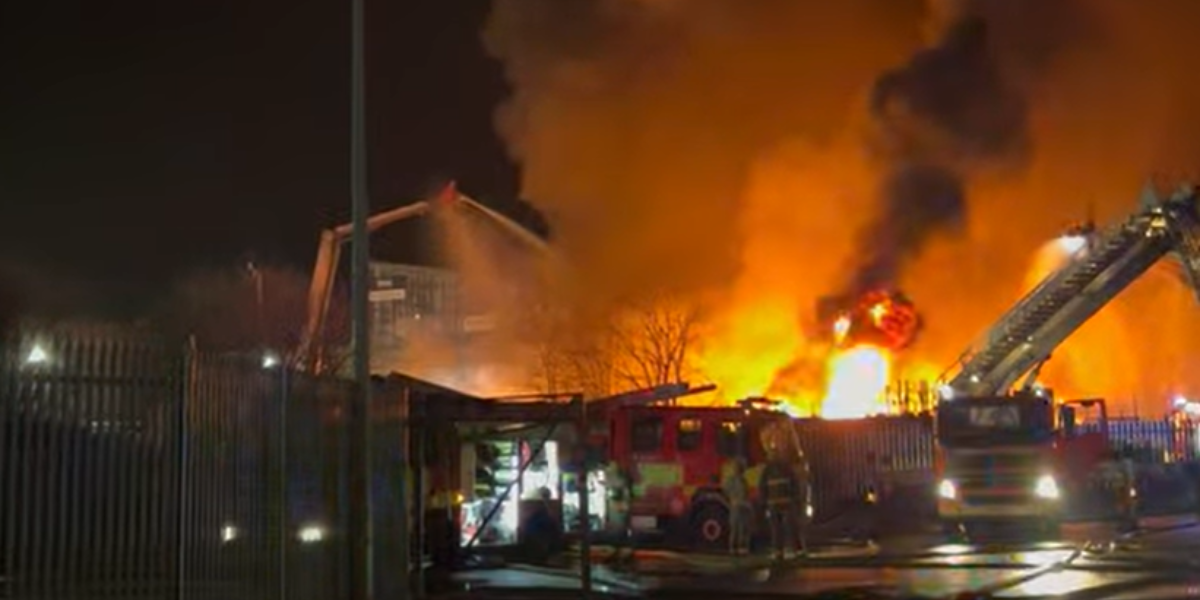 NextImg:Blackburn fire: Thick black smoke seen for miles as blaze rages through industrial estate