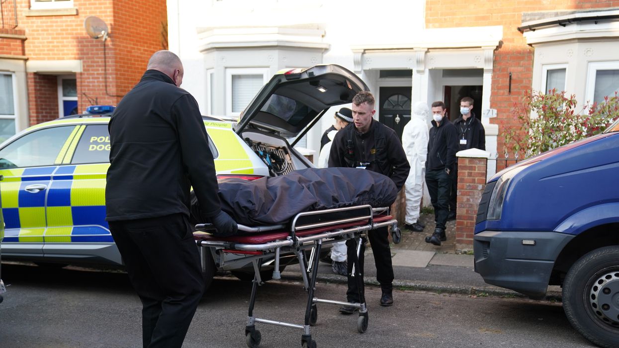 The body is removed from the property in Moore Street, Kingsley, Northampton.