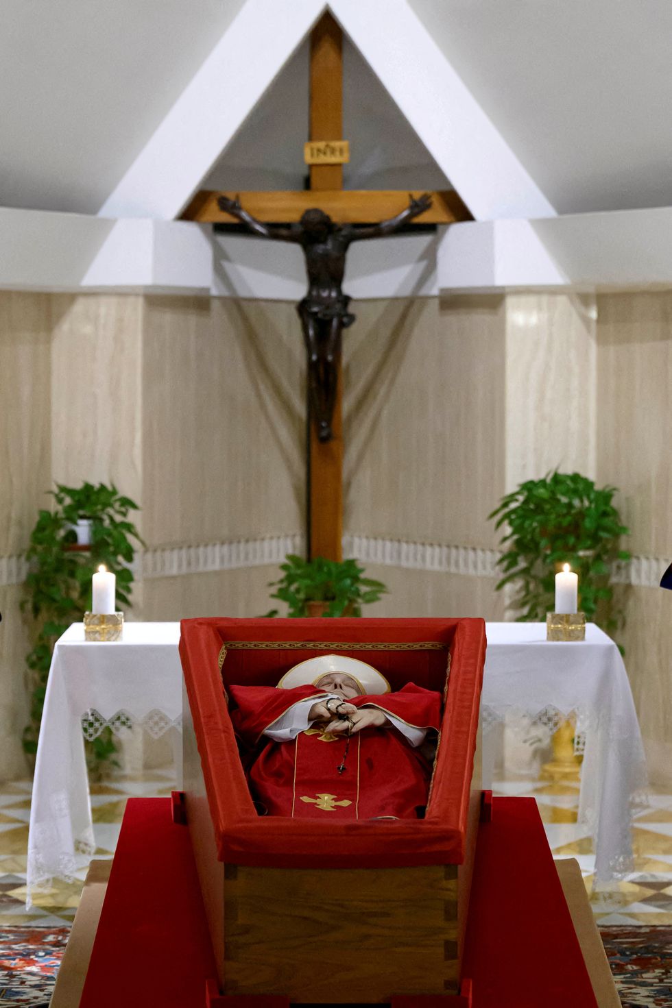 The body of Pope Francis is placed in an open casket during the rite of the declaration of death in Santa Marta residence at the Vatican