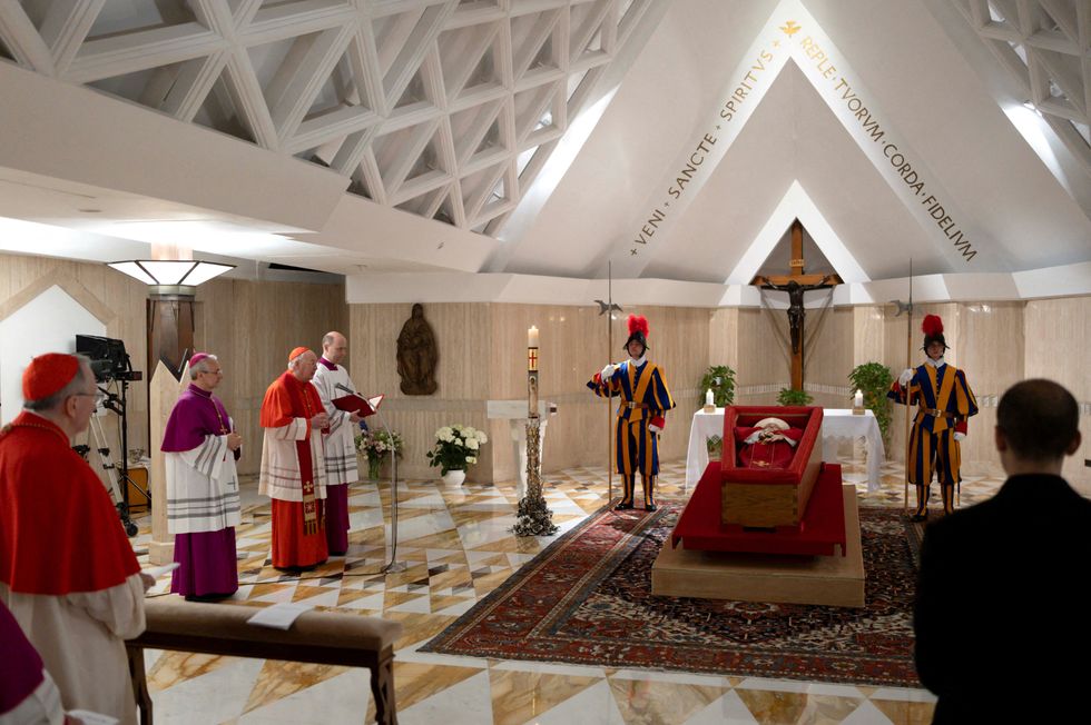 The body of Pope Francis is placed in an open casket during the rite of the declaration of death in Santa Marta residence at the Vatican
