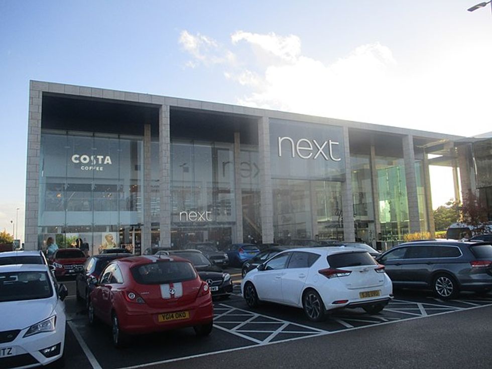 The boss of clothing firm Next has urged the Government to let more foreign workers into the UK.