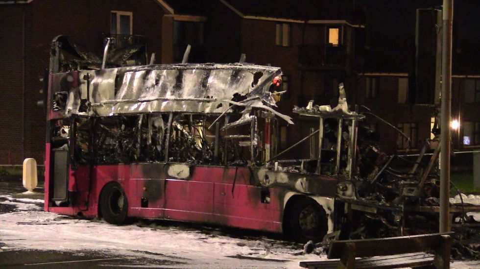 The burnt out double decker bus in Church Road near Rathcoole in Newtownabbey, Co Antrim after it was hijacked and set on fire near a loyalist estate on the outskirts of Belfast. Picture date: Sunday November 7, 2021.