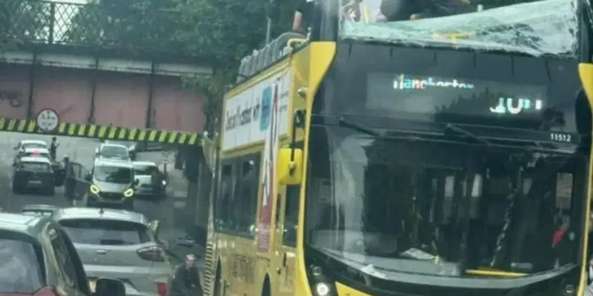 NextImg:Driver arrested after top level of double-decker bus ripped off in bridge collision