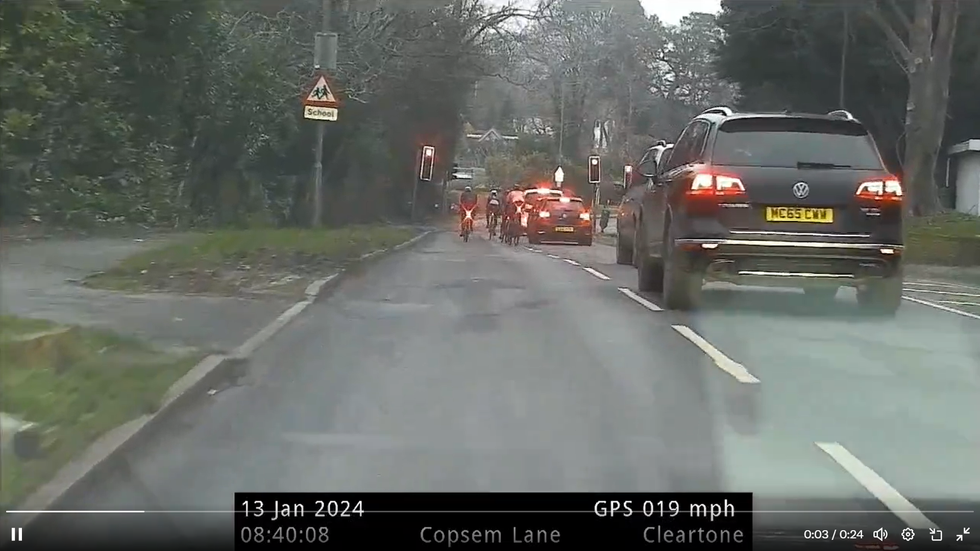 The camera footage of the cyclists running the red light