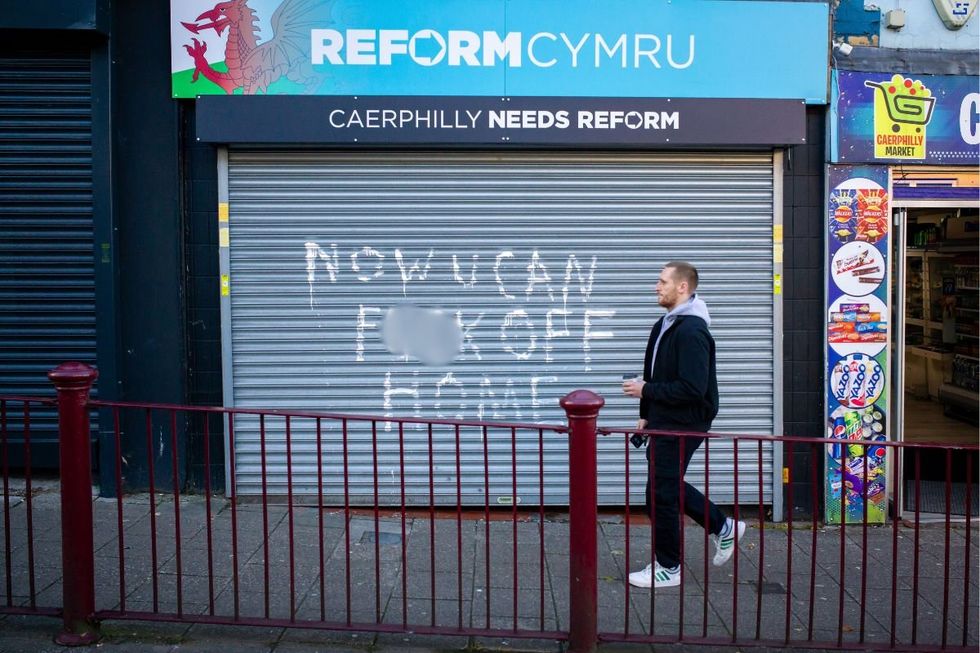 The campaign office, located on Caerphilly's Cardiff Street, had an expletive message emblazoned across its shutters