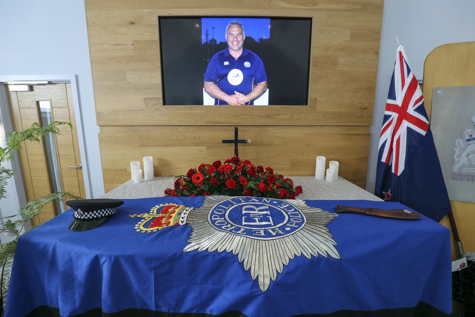 The coffin and floral tributes in the church before the funeral service of police officer Sergeant Matt Ratana in Shoreham-by-Sea, West Sussex.