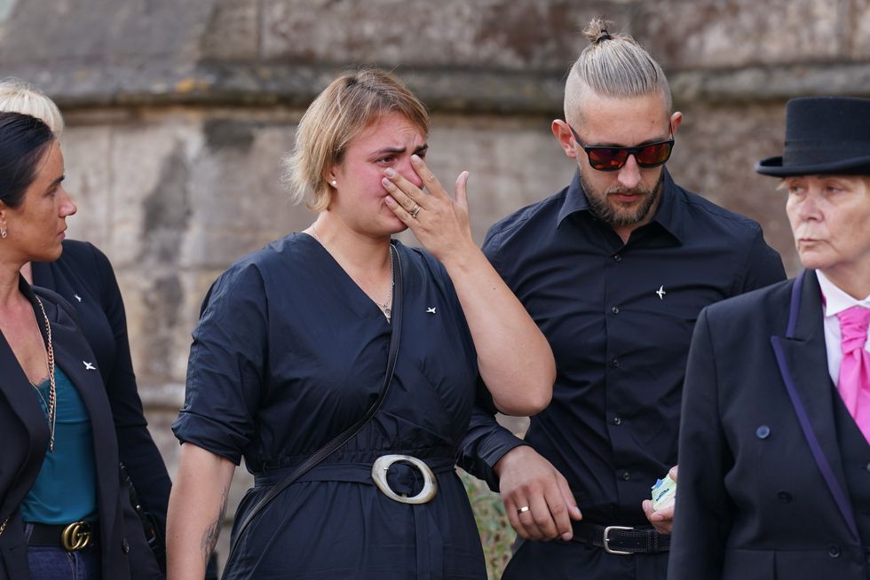 The coffin of nine-year-old stabbing victim Lilia Valutyte being carried into St Botolph's Church in Boston, Lincolnshire followed by her mother Lina Savicke and step-father Aurelijus Savickas.