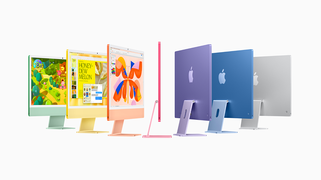 the complete lineup of apple imac computers in all seven new colours: Green, Yellow, Orange, Pink, Purple, Blue, and Silver