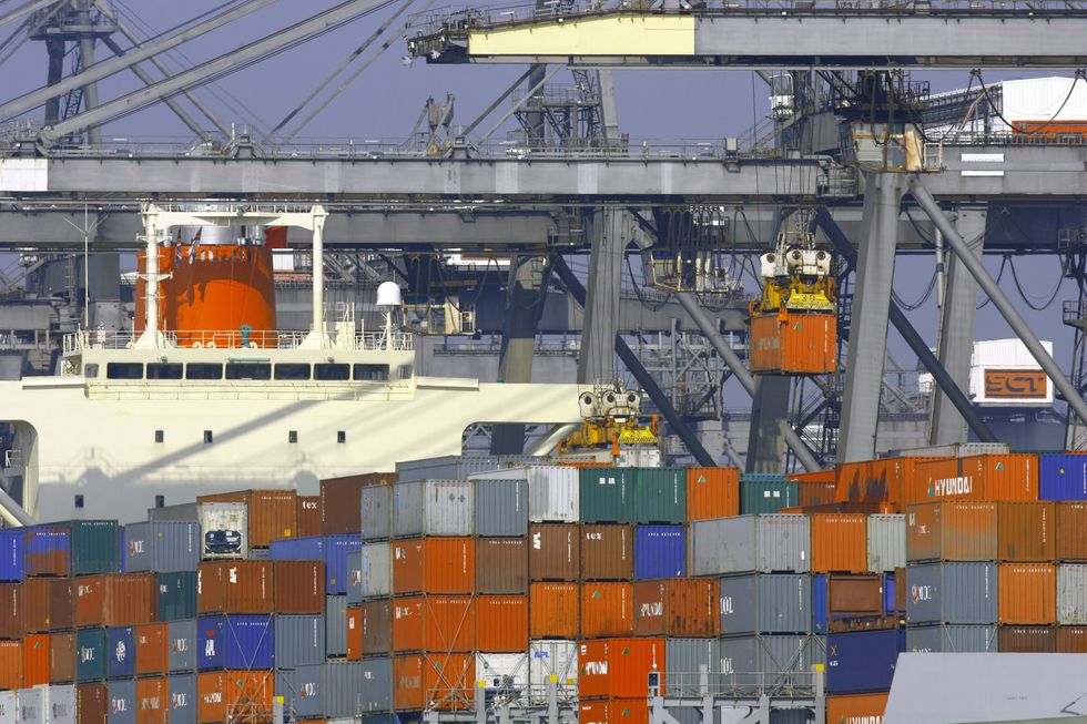 The container ship MOL Pace from Panama unloads her cargo at Southampton Container Terminal