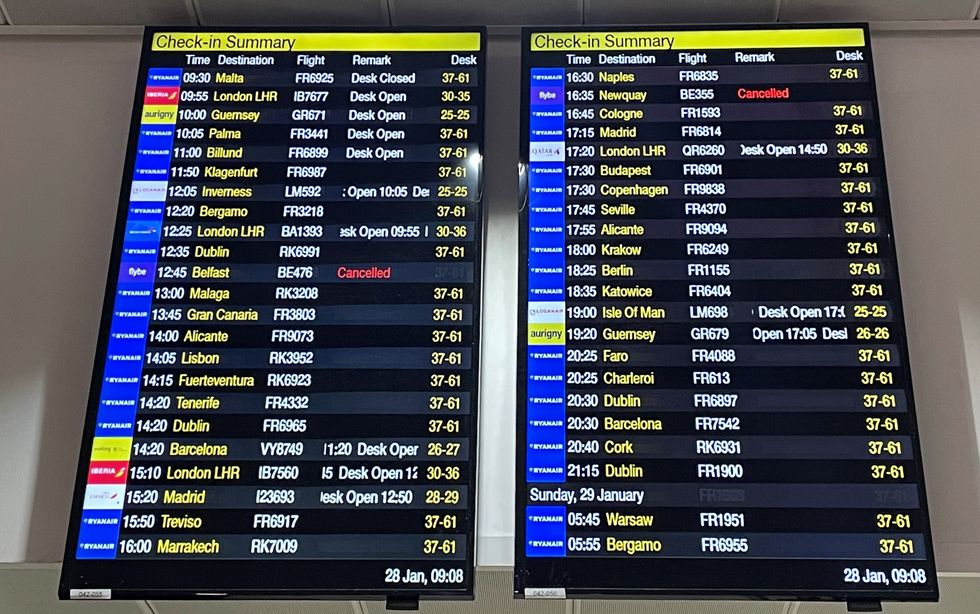 The departure boards at Manchester Airport showing two cancelled Flybe flights as the regional carrier has ceased trading and all scheduled flights have been cancelled, authorities have said. Picture date: Saturday January 28, 2023.