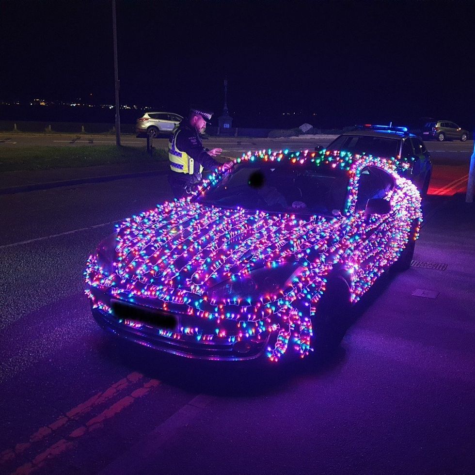 The driver with Christmas lights on his car was slapped with a fine