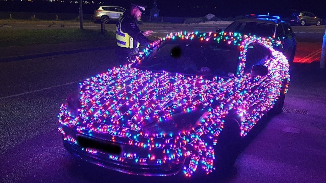 The driver with Christmas lights on his
