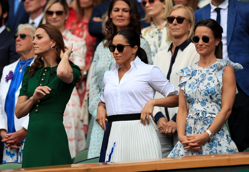 The Duchess of Cambridge and The Duchess of Sussex with Pippa Matthews on day twelve of the Wimbledon Championships at the All England Lawn Tennis and Croquet Club, Wimbledon.
