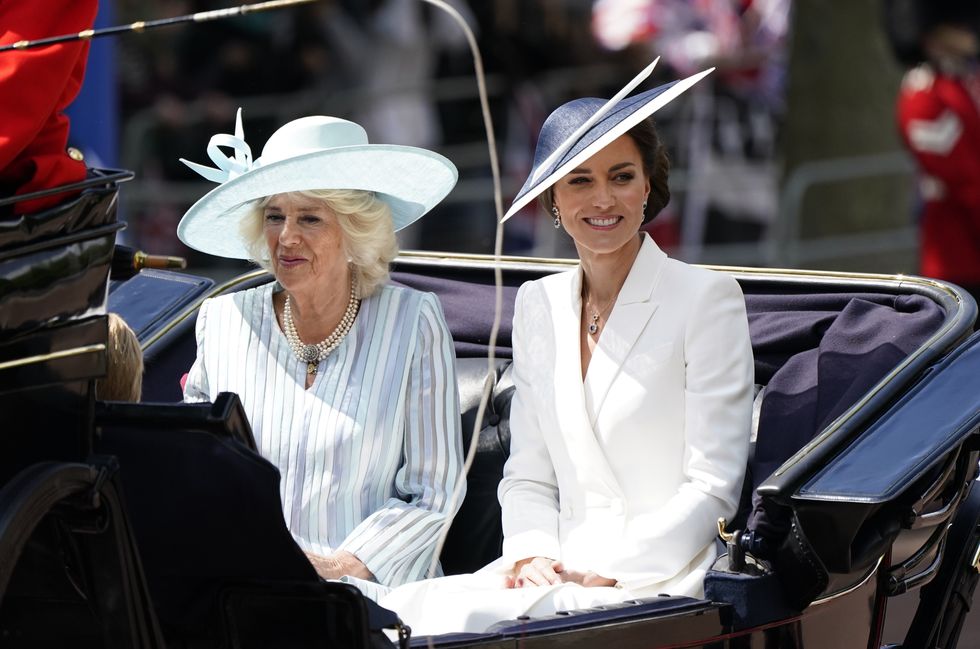 The Duchess of Cornwall and the Duchess of Cambridge ride in a carriage as the Royal Procession leaves Buckingham Palace for the Trooping the Colour ceremony at Horse Guards Parade, central London