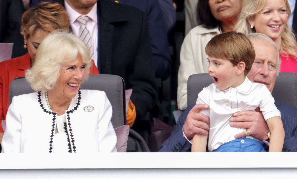 The Duchess of Cornwall laughs with Prince Louis during the Platinum Jubilee Pageant in front of Buckingham Palace, London, on day four of the Platinum Jubilee celebrations for Queen Elizabeth II. Picture date: Sunday June 5, 2022.