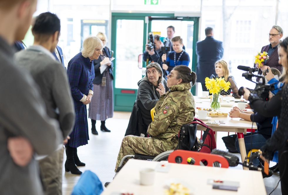 The Duchess of Cornwall meeting DJ, 49, during her visit to the UKHarvest charity's West London 'Nourish Hub' . The community kitchen is designed to combat social isolation and loneliness.Picture date: Thursday February 10, 2022.