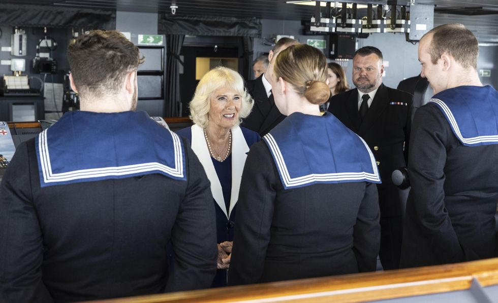 The Duchess of Cornwall talks to crew members while on the bridge of HMS Prince of Wales at Her Majesty's Naval Base, Portsmouth before the aircraft carrier deploys to the Mediterranean as the flagship for the NATO Response Force Task Group. Picture date: Thursday May 12, 2022.