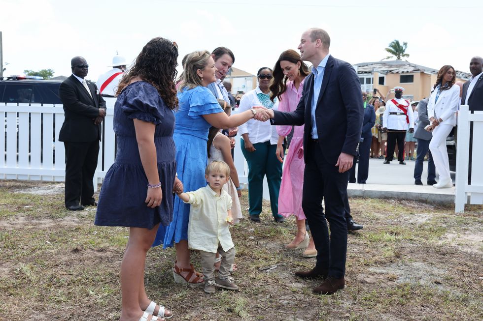 The Duke and Duchess of Cambridge meet with children during a visit to the Memorial Wall to remember victims of the 2019 hurricane at the Memorial Garden in Abaco, on day eight of their tour of the Caribbean on behalf of the Queen to mark her Platinum Jubilee. Abaco, a chain of islands and barrier cays in the northern Bahamas, was hit by winds of up to 185mph during Hurricane Dorian in 2019 leaving 75% of homes across the chain of islands damaged and resulting in tragic loss of life. Picture date: Saturday March 26, 2022.
