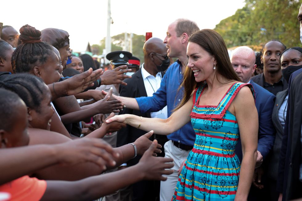 The Duke and Duchess of Cambridge shake hands with locals during a visit Trench Town, the birthplace of reggae in Kingston, Jamaica, on day four of their tour of the Caribbean on behalf of the Queen to mark her Platinum Jubilee. Picture date: Tuesday March 22, 2022.